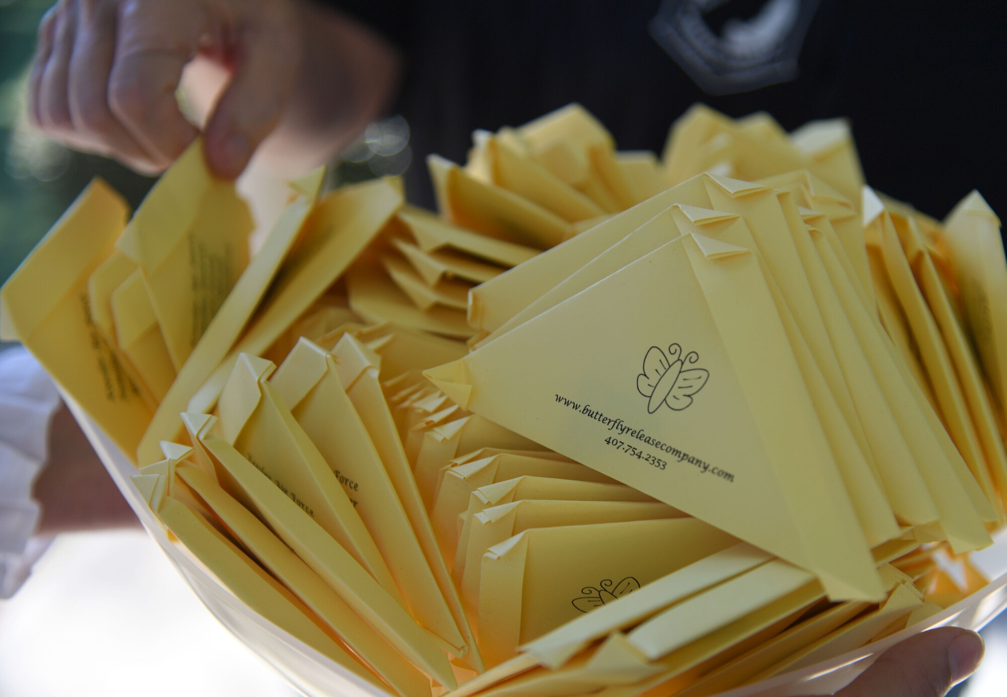 Packaged butterflies are displayed during the Air Force Families Forever Fallen Heroes Butterfly Garden dedication ceremony at the marina park at Keesler Air Force Base, Mississippi, Sept. 24, 2021. The garden was created as a designated location where the families of our fallen heroes can find a serene area to pay tribute to their loved one as well as honoring our fallen service members. (U.S. Air Force photo by Kemberly Groue)