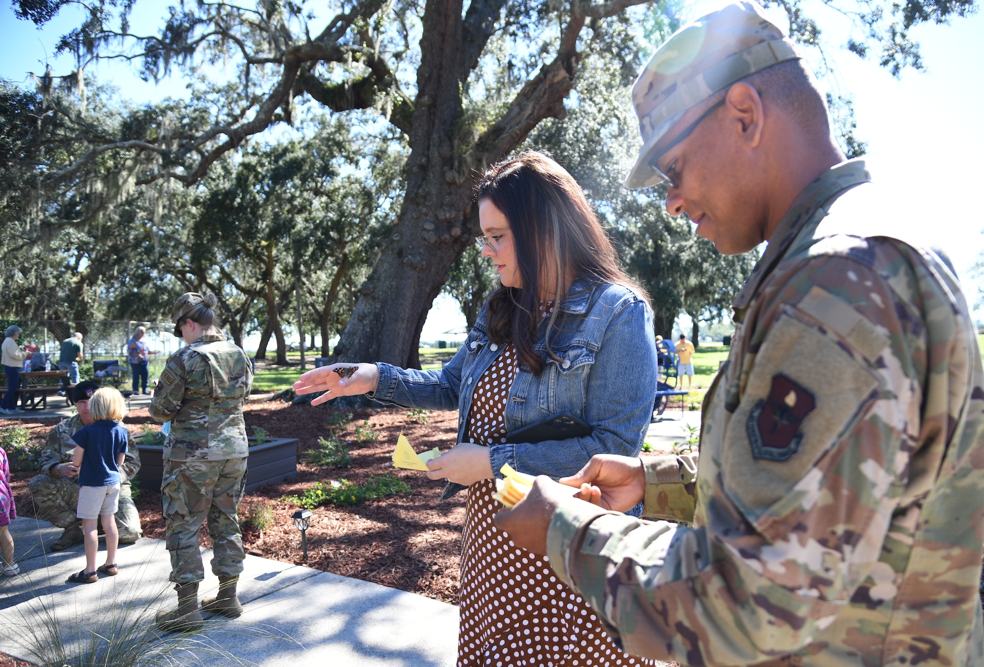 U.S. Air Force Chaplain (1st Lt.) Angel Aquino, 81st Training Wing chaplain, and his wife, Brittney Aquino, release butterflies during the Air Force Families Forever Fallen Heroes Butterfly Garden dedication ceremony at the marina park at Keesler Air Force Base, Mississippi, Sept. 24, 2021. The garden was created as a designated location where the families of our fallen heroes can find a serene area to pay tribute to their loved one as well as honoring our fallen service members. (U.S. Air Force photo by Kemberly Groue)