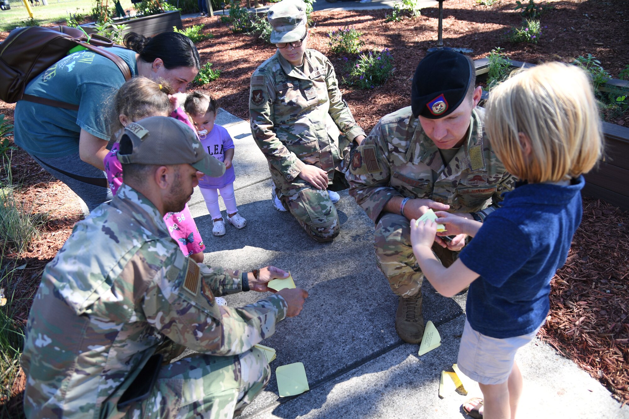 Keesler families release butterflies during the Air Force Families Forever Fallen Heroes Butterfly Garden dedication ceremony at the marina park at Keesler Air Force Base, Mississippi, Sept. 24, 2021. The garden was created as a designated location where the families of our fallen heroes can find a serene area to pay tribute to their loved one as well as honoring our fallen service members. (U.S. Air Force photo by Kemberly Groue)