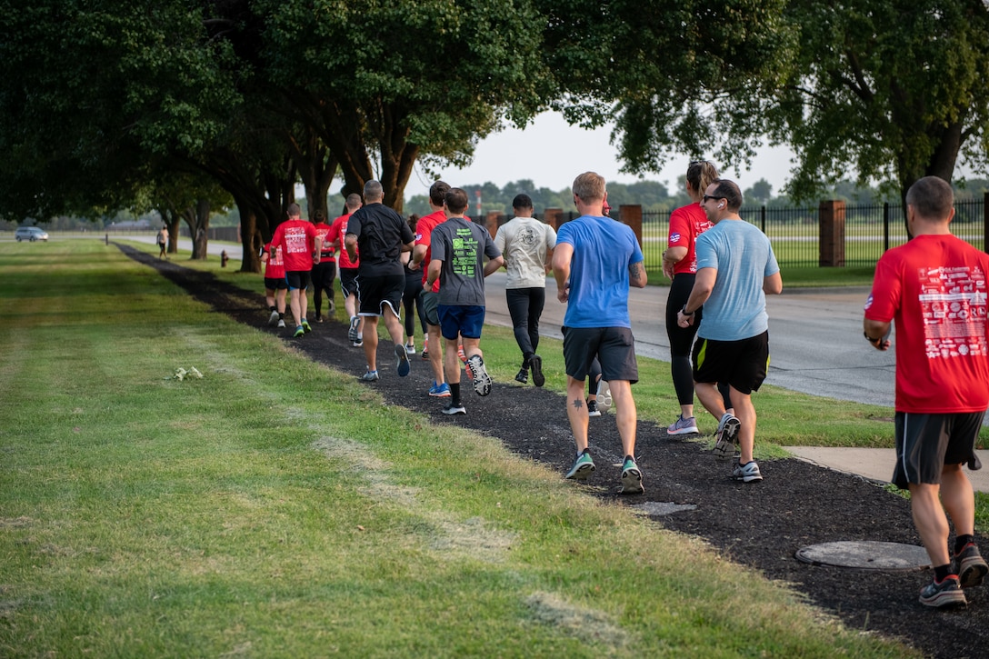 Airmen from the 73rd Airlift Squadron, 54th Airlift Squadron and 932nd Operations Support Flight virtually participate in the Bradley R. Smith memorial scholarship 5k run, 9 Sept. 2021, Scott Air Force Base, Illinois.