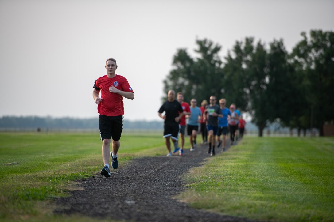 Airmen from the 73rd Airlift Squadron, 54th Airlift Squadron and 932nd Operations Support Flight virtually participate in the Bradley R. Smith memorial scholarship 5k run, 9 Sept. 2021, Scott Air Force Base, Illinois.