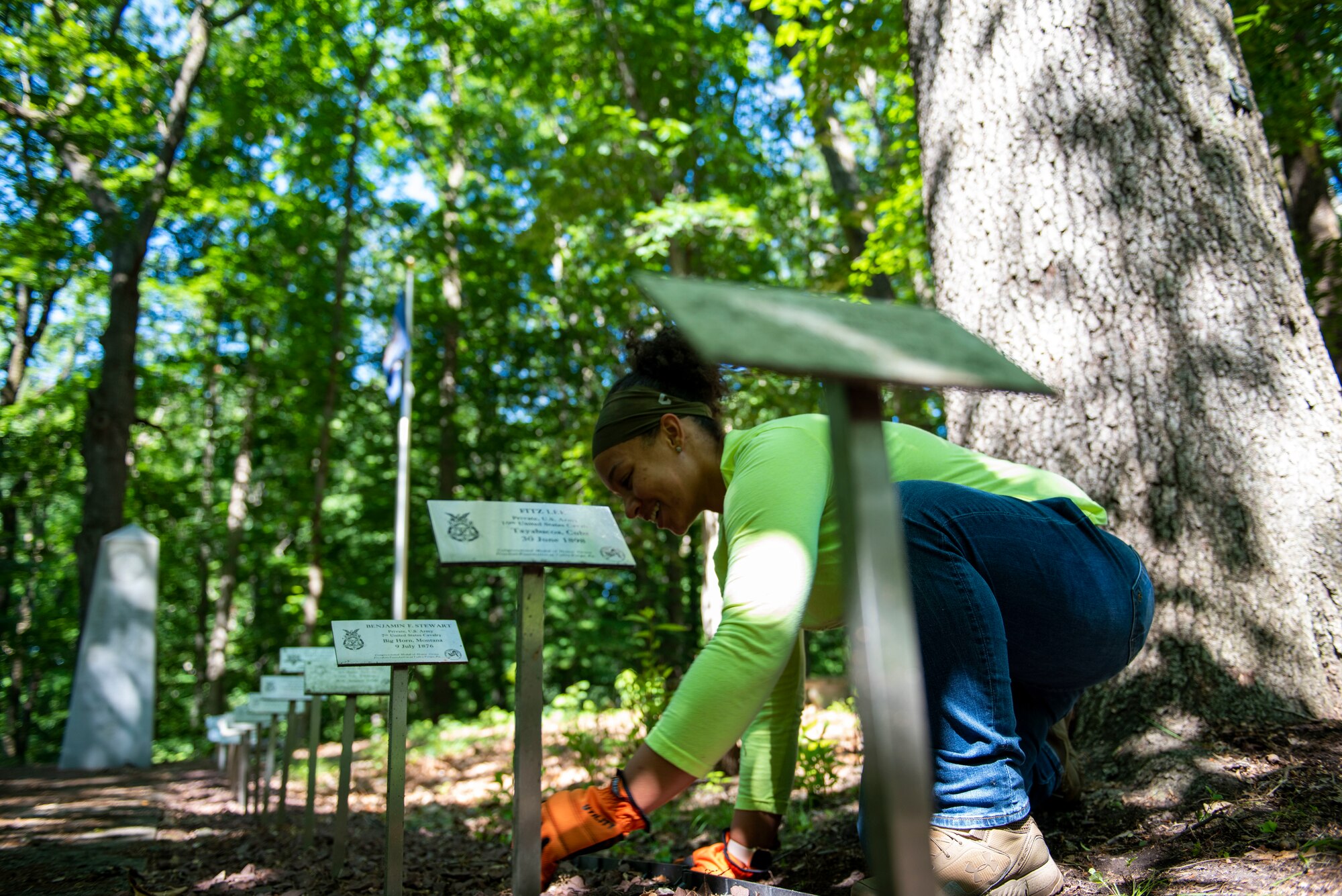 A woman cleans near elevated plaques.