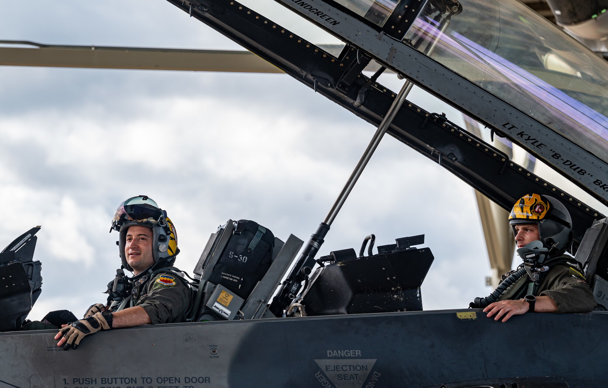 Photo of Airmen preparing to takeoff in an F-16