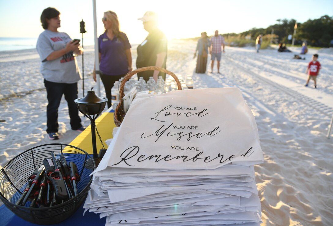 Unlit lanterns are on display during the Air Force Families Forever Fallen Hero Sky Lantern Lighting on the Biloxi Beach, Mississippi, Sept. 24, 2021. The event, hosted by Keesler Air Force Base, included eco-friendly sky lanterns released in honor of fallen heroes. (U.S. Air Force photo by Kemberly Groue)