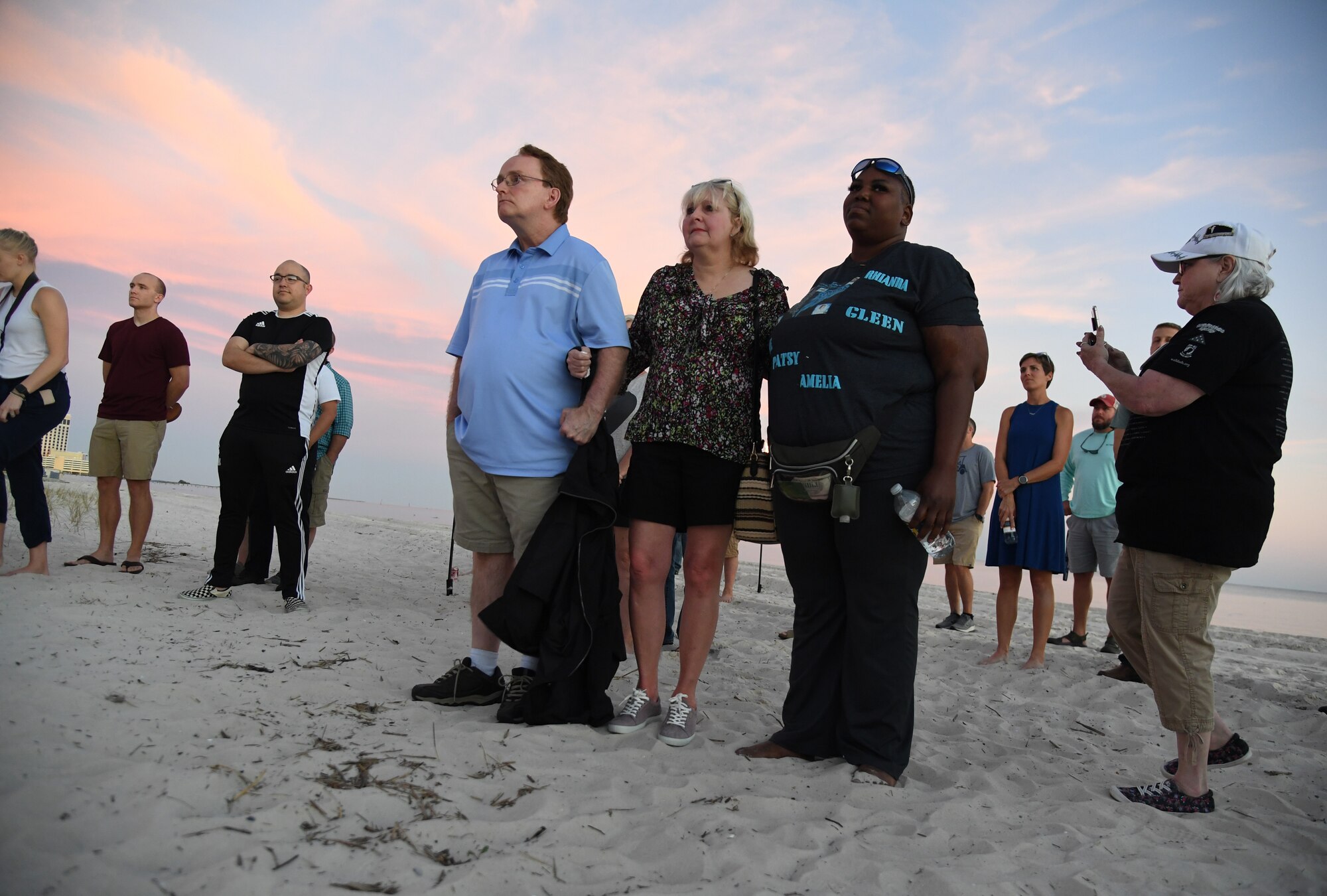 Military families gather during the Air Force Families Forever Fallen Hero Sky Lantern Lighting on the Biloxi Beach, Mississippi, Sept. 24, 2021. The event, hosted by Keesler Air Force Base, included eco-friendly sky lanterns released in honor of fallen heroes. (U.S. Air Force photo by Kemberly Groue)