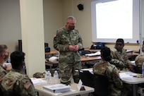 Brig. Gen. Jeffrey C. Coggin, commanding general of the U.S. Army Civil Affairs and Psychological Operations Command (Airborne) addresses U.S. Army Reserve Soldiers from USACAPOC(A) who are taking part in Joint Light Tactical Vehicle (JLTV) introduction training Aug. 25-26, 2021, at USACAPOC(A) Headquarters, Fort Bragg, N.C., as part of initial JLTV fielding for the command.