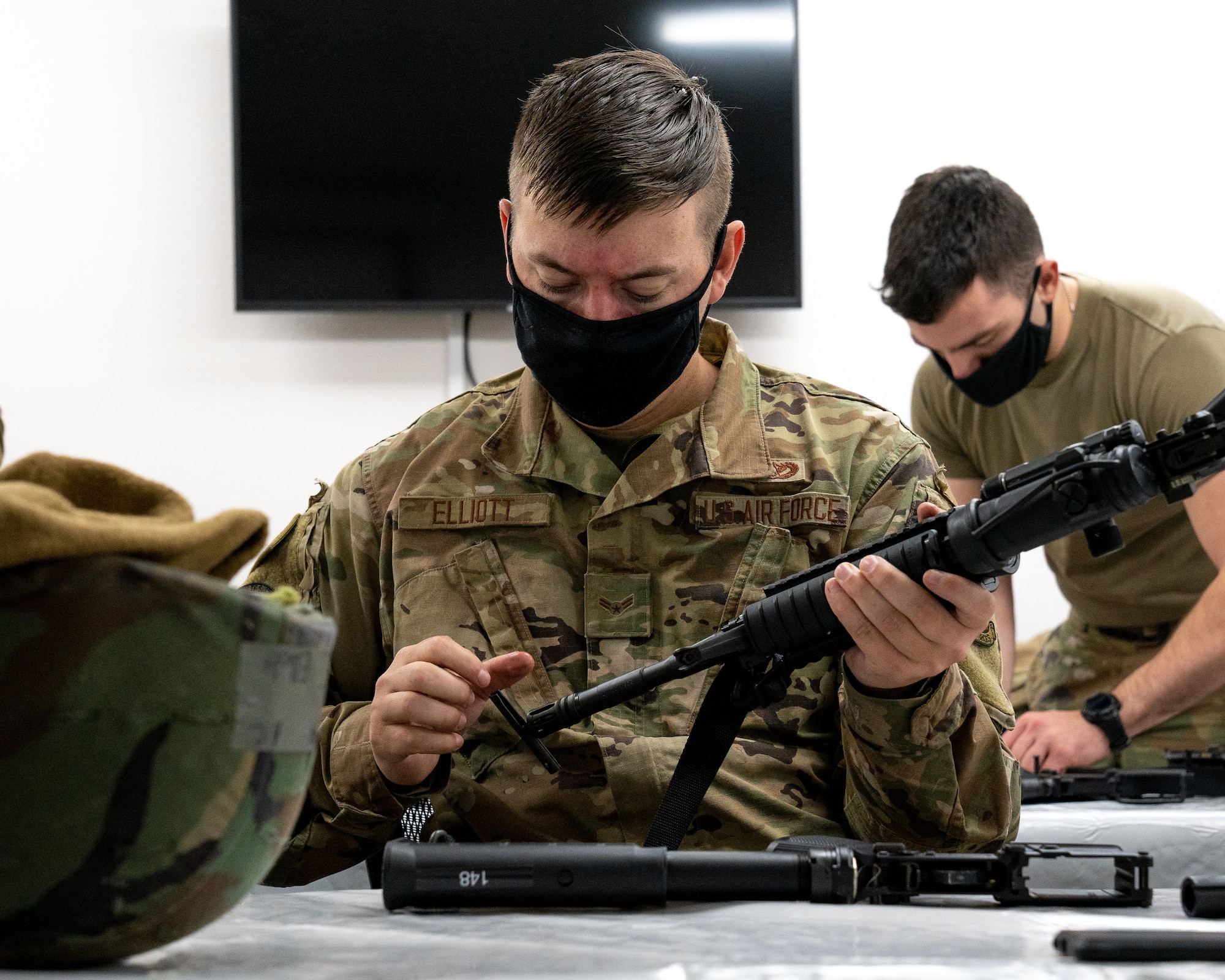 U.S. Air Force Airman 1st Class Matthew Elliot, a 773d Civil Engineer Squadron water and fuel systems maintenance technician, assembles his M4 carbine.