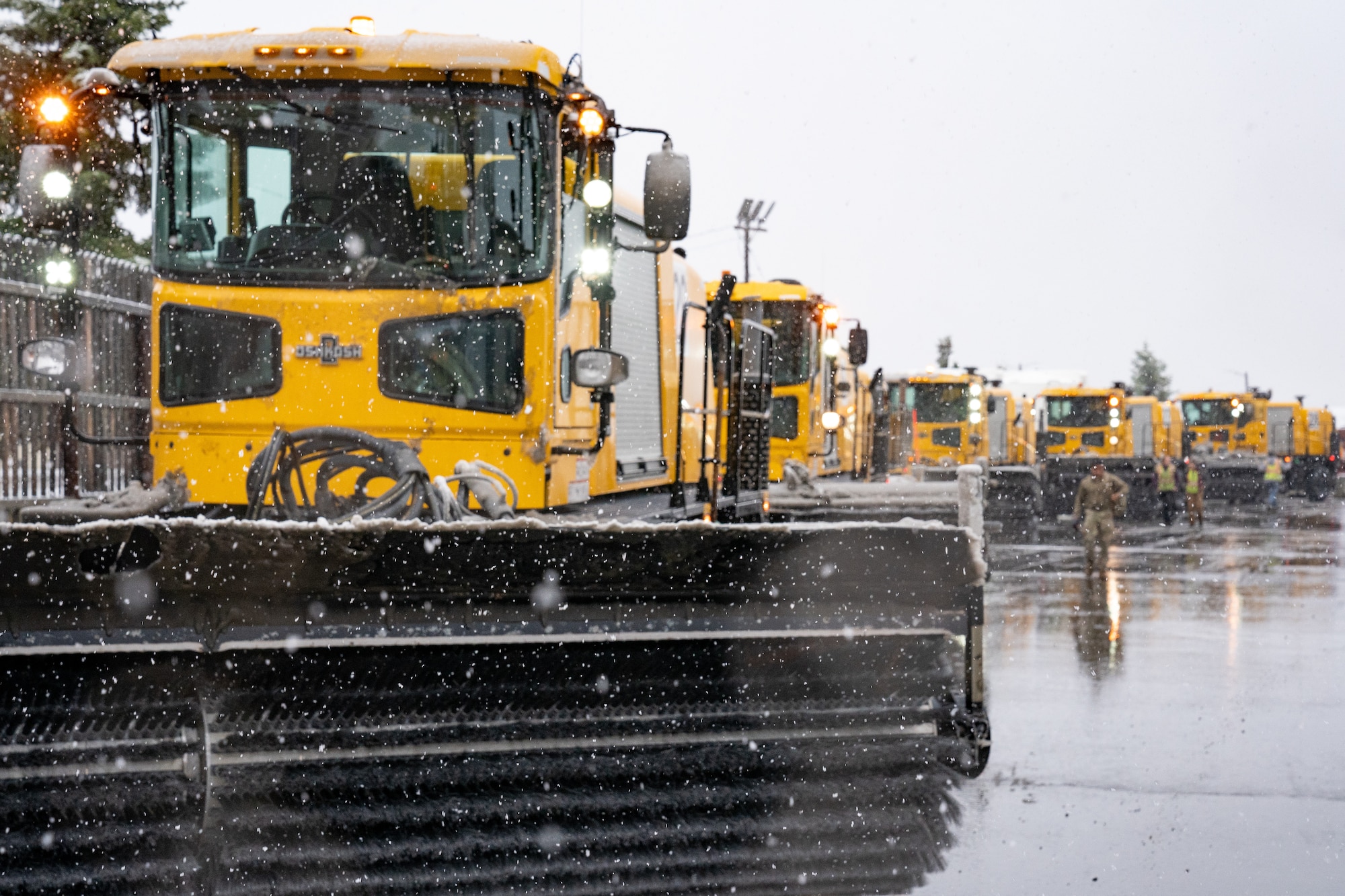 A fleet of snow sweepers return to the 773d Civil Engineer Squadron’s Snow Barn after clearing an early-season snowfall from the flight line.