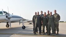 Members of the 931st Air Refueling Wing pose on the flightline at McConnell Air Force Base Kansas, after taking part in the organized fly-in event ept. 11, 2021.