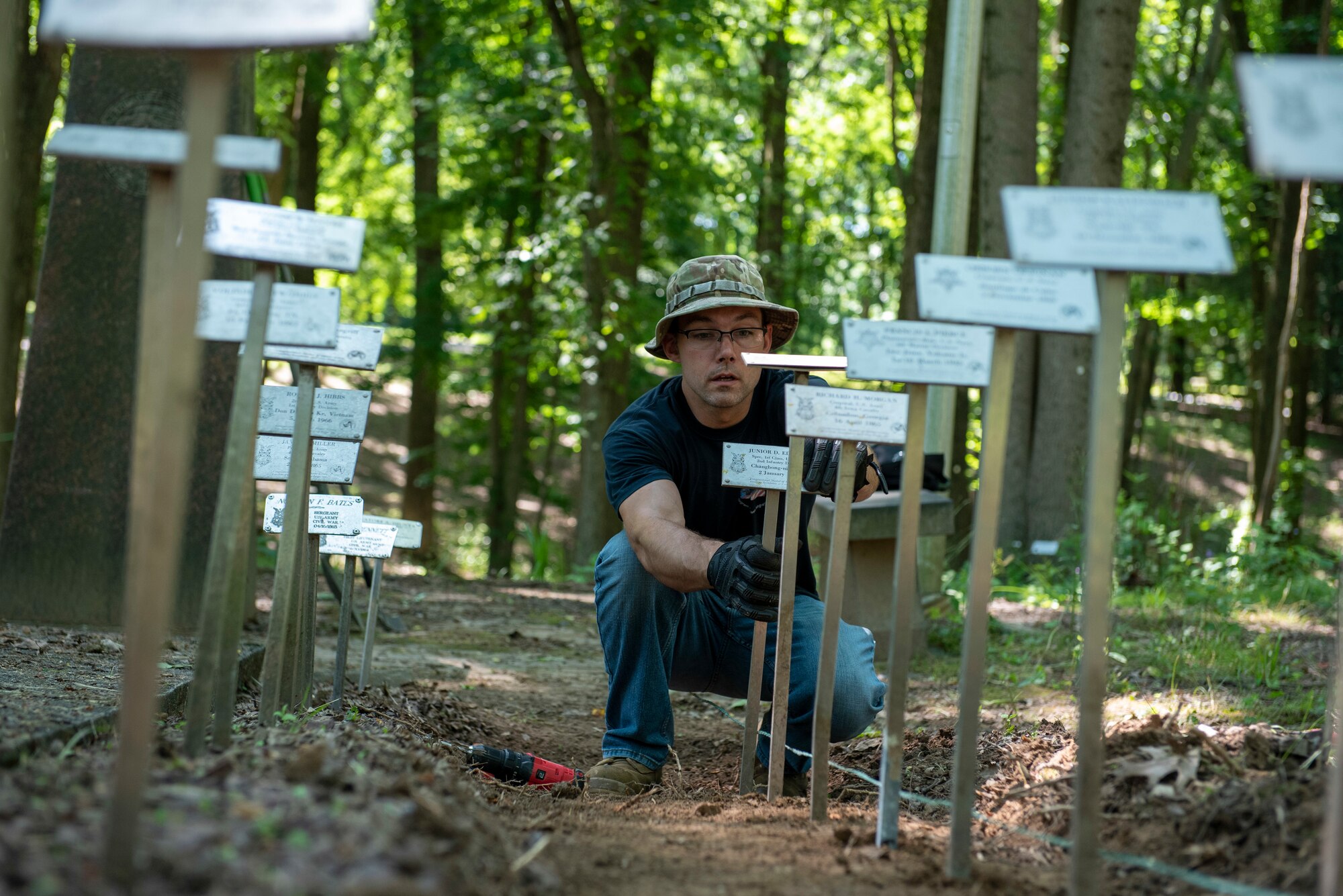 A man cleans near elevated plaques.