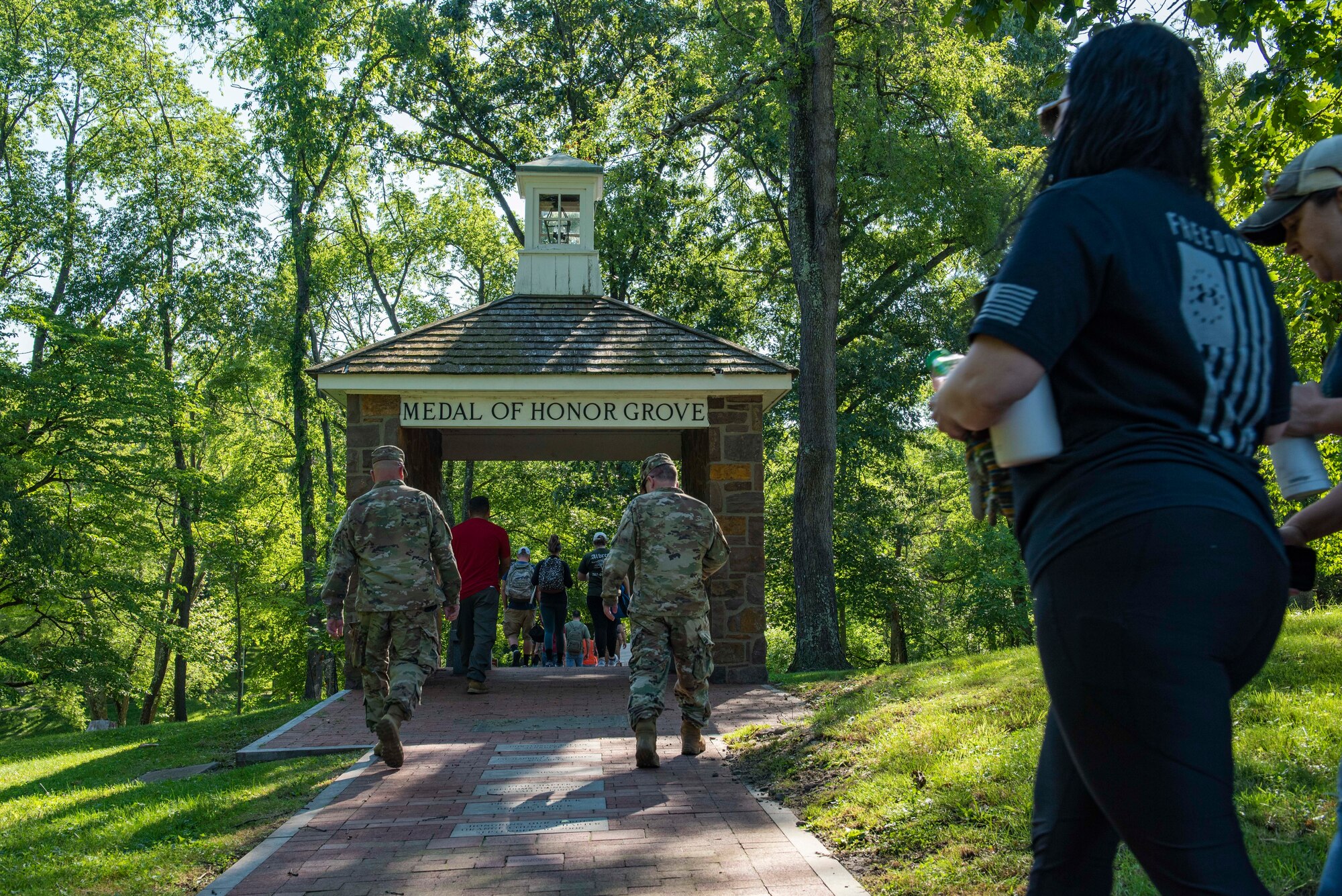 Men and women walk into Medal of Honor Grove in Medal of Honor Grove at Valley Forge, Pennsylvania.