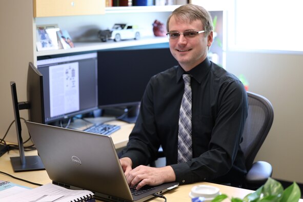 Man sitting in front of a computer