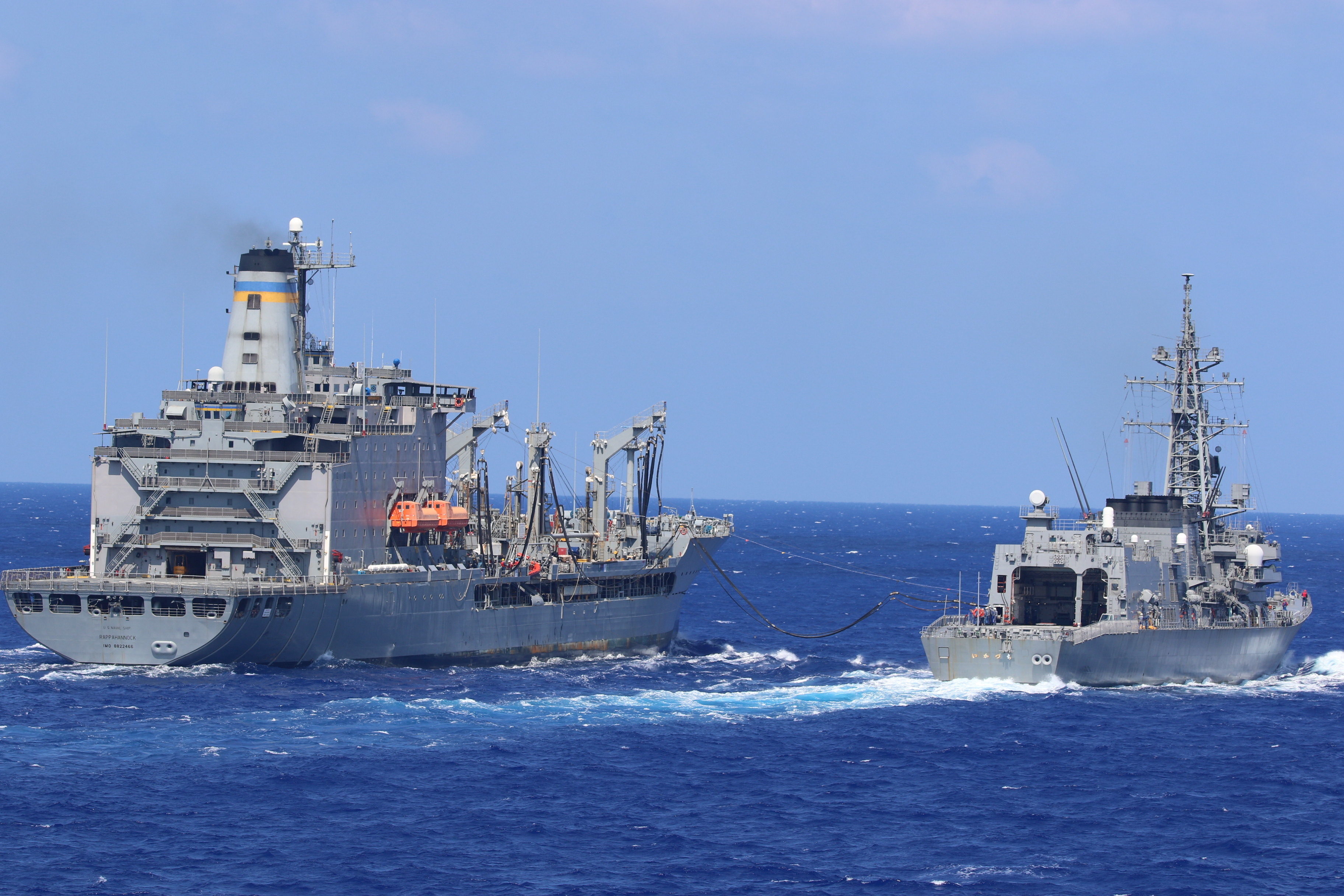 USNS Rappahannock (T-AO 204) conducts a replenishment-at-sea with the Japan Maritime Self-Defense Force (JMSDF) Murasame-class destroyer JS Ikazuchi (DD 107), Sept. 24, 2021.