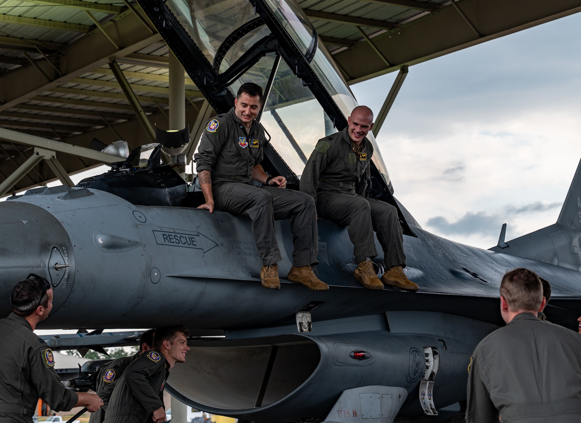 Photo of Airmen departing an F-16