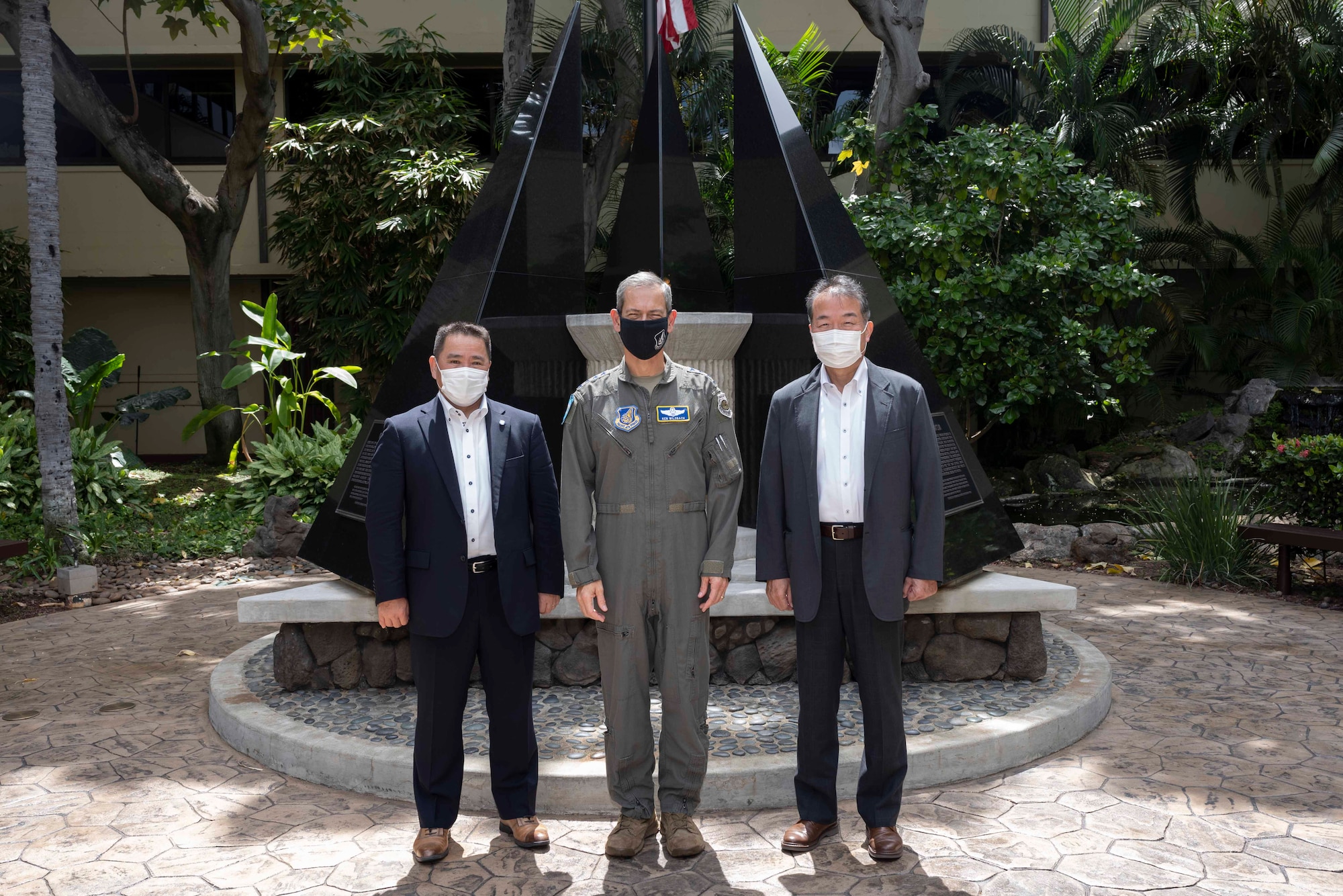 Photo of  Gen. Ken Wilsbach, Pacific Air Forces commander (center), standing with Japan Air Self-Defense Force Lt. Gen. (ret.) Junichi Araki, (left), and JASDF Gen. (ret.) Yoshiyuki Sugiyama