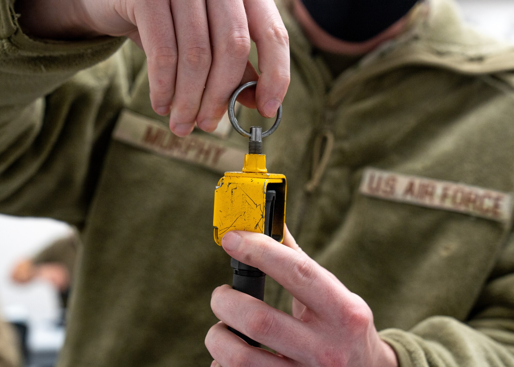 U.S. Air Force Airman 1st Class Seth Murphy, a 773d Civil Engineer Squadron material control apprentice, applies a blank firing adapter to the end of his M4 carbine during Prime Base Engineer Emergency Force Day.