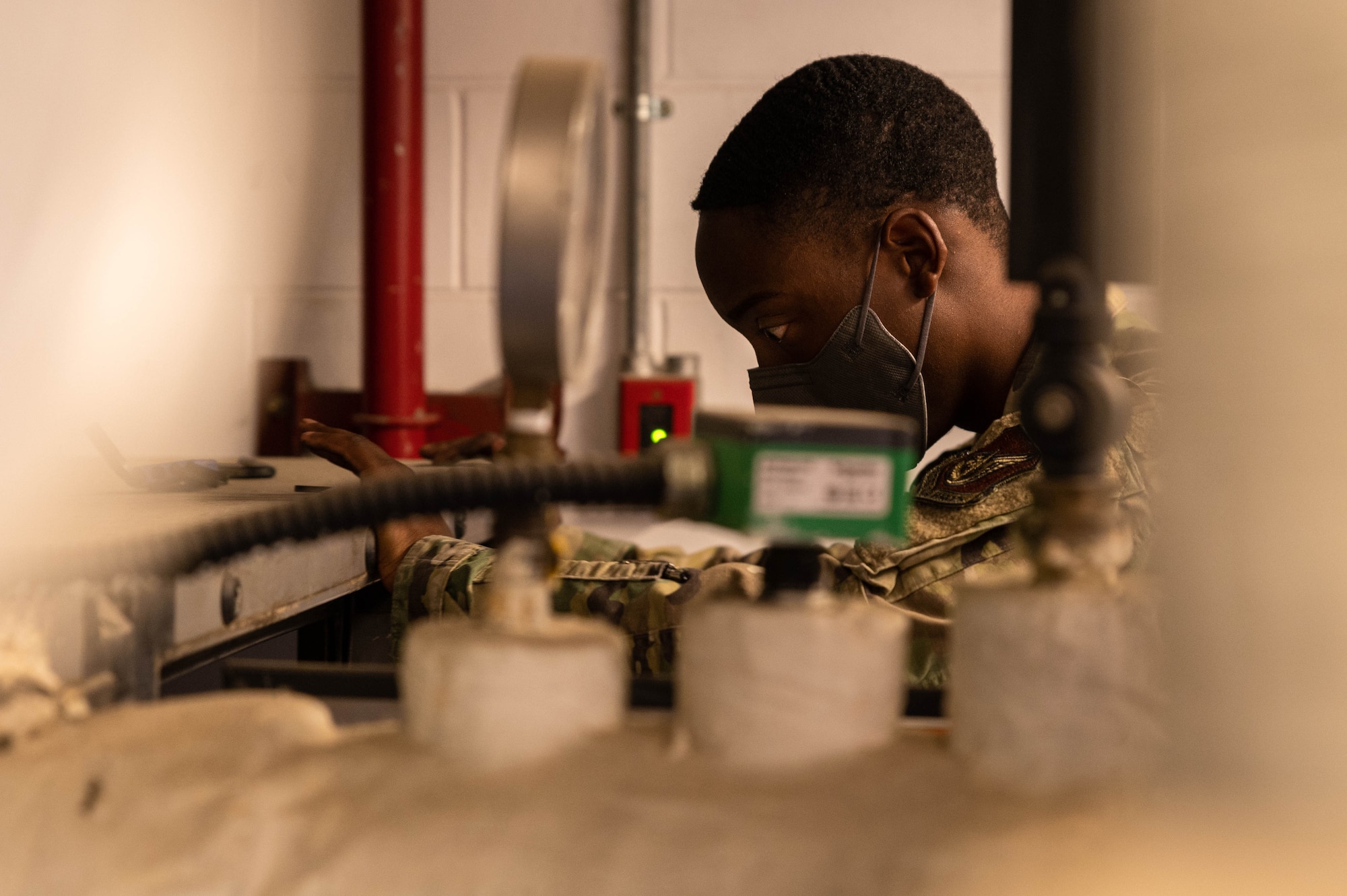 Senior Airman Sherquon Anderson, 51st Civil Engineering Squadron heating ventilation and air conditioning (HVAC) technician, works on an air handling unit