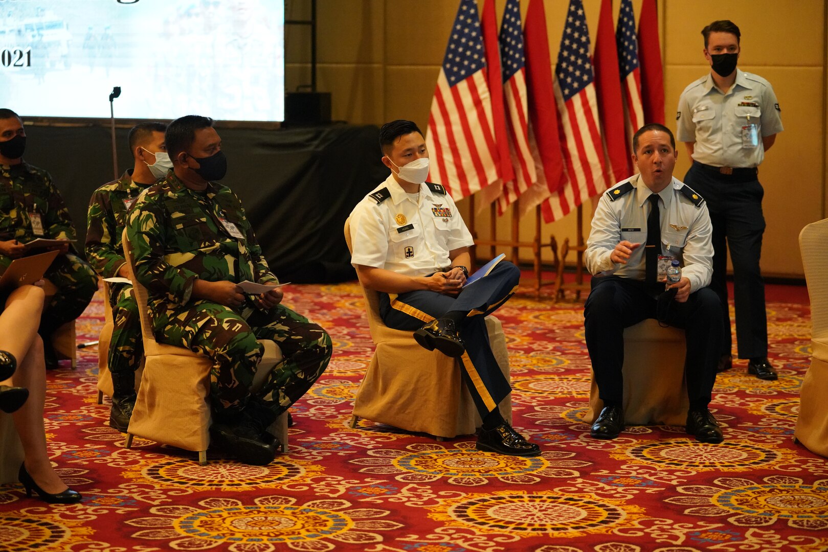 Maj. Derek Betz, Air National Guard, discusses the airspace management portion of Joint Exercise GEMA BHAKTI with the exercise joint staff comprised of members of the Tentara Nasional Indonesia, U.S. Army, Navy, Marines and the Hawaii National Guard, Sept. 23, 2021, Jakarta Indonesia. GB21 is a Chairman, Joint Chiefs of Staff staff exercise between USINDOPACOM and TNI to improve joint, operational staff planning and processes.