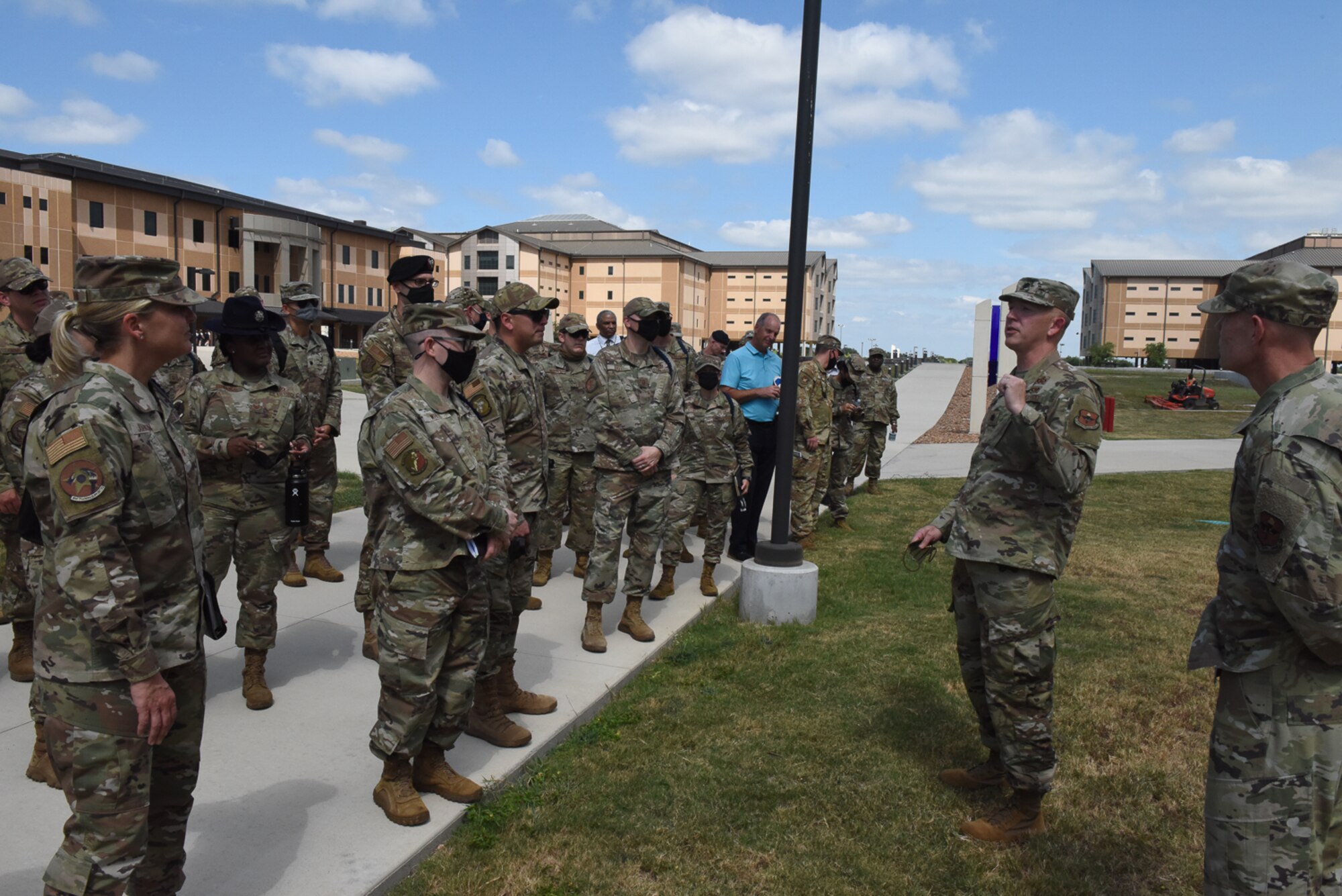 Commander briefs conference attendees outside the 321st TRS