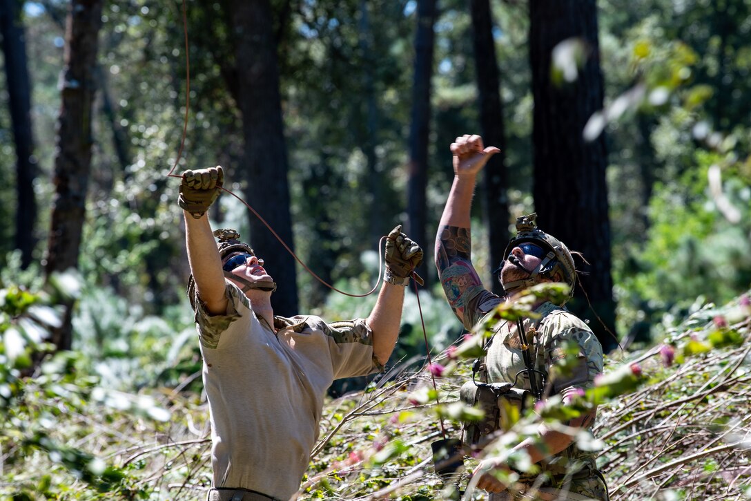 Photo of Airmen in the woods
