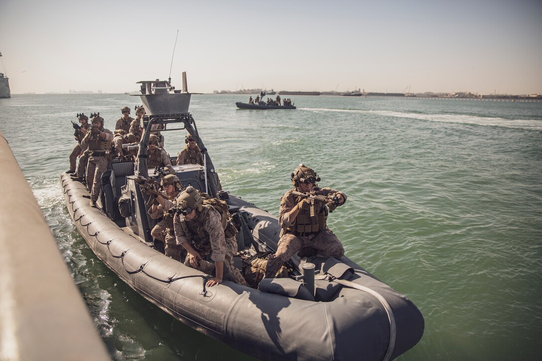 NAVAL SUPPORT ACTIVITY BAHRAIN (Sept. 22, 2021) – Marines assigned to the 11th Marine Expeditionary Unit (MEU), prepare to board the fleet ocean tug USNS Catawba (T-ATF 168) from a rigid-hull inflatable boat during a visit, board, search, and seizure exercise, Sept. 22. The 11th MEU is deployed to the U.S. 5th Fleet area of operations in support of naval operations to ensure maritime stability and security in the Central Region, connecting the Mediterranean and Pacific through the Western Indian Ocean and three strategic choke points. (U.S. Marine Corps Photo by Staff Sgt. Victor Mancilla)