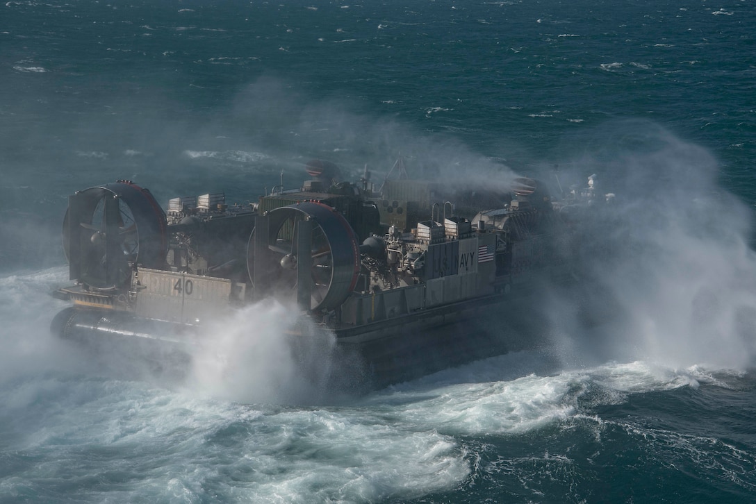 ARABIAN GULF (Sept. 26, 2021) Landing craft, air cushion attached to Assault Craft Unit Five (ACU 5) conducts well deck operations with the amphibious assault ship USS Essex (LHD 2), Sept. 26. ACU 5 is deployed with Essex and the 11th Marine Expeditionary Unit to the U.S. 5th Fleet area of operations in support of naval operations to ensure maritime stability and security in the Central Region, connecting the Mediterranean and the Pacific through the western Indian Ocean and three strategic choke points. (U.S. Navy photo by Mass Communication Specialist 2nd Class Jenna Dobson)