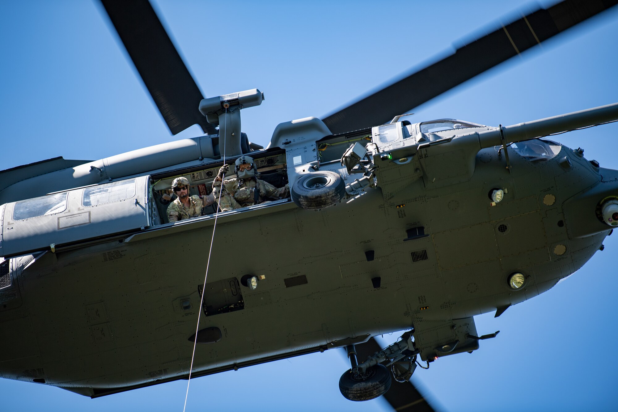 Photo of an airborne helicopter from the ground