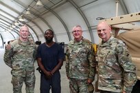 Deputy Commanding General for U.S. Army Reserve Command, Maj. Gen. Gregory J. Mosser (left), stands with Jerry Jones, project manager for USACAPOC(A) Joint Light Tactical Vehicle (JLTV) New Equipment Fielding (NEF) site (center left), U.S. Army Civil Affairs & Psychological Operations Command (Airborne) Commanding General, Brig. Gen. Jeffrey C. Coggin (center right), and USACAPOC(A) Deputy Commanding General, Brig. Gen. Michael M. Greer (right), Aug. 27, 2021. Soldiers from USACAPOC(A) took part in JLTV introduction training Aug. 23-27, 2021, at the command headquarters, Fort Bragg, N.C., as part of initial JLTV fielding for the command.