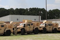 A U.S. Army Reserve Soldier from the U.S. Army Civil Affairs and Psychological Operations Command (Airborne) ground guides a Joint Light Tactical Vehicle (JLTV) at the JLTV New Equipment Fielding (NEF) site, Aug. 27, 2021, Fort Bragg, N.C. Soldiers from USACAPOC(A) took part in JLTV introduction training Aug. 23-27, 2021, at the command headquarters, Fort Bragg, N.C., as part of initial JLTV fielding for the command.