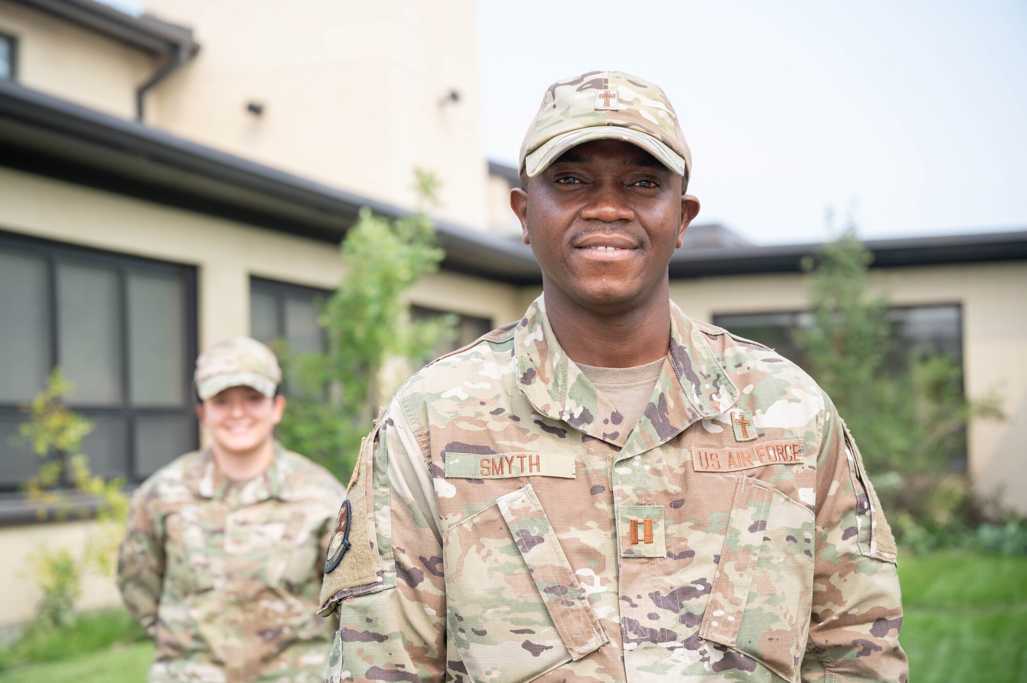 Chaplain (Capt.) Dominic Smyth, front, 341st Missile Wing, and Tech. Sgt. Kelly Mays, back, 341st MW chaplain assistant, pose for a photo Sept. 9, 2021 at Malmstrom Air Force Base Mont.