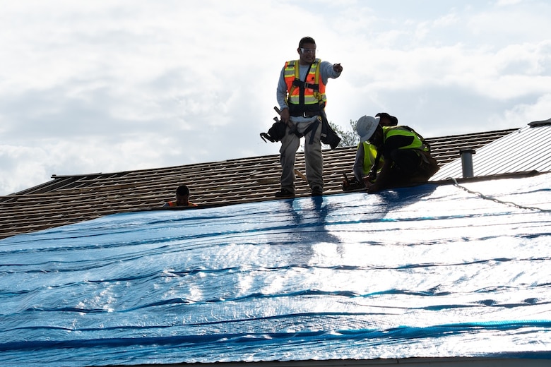 Contractors install Blue Roofs on homes damaged by Hurricane Ida in LaPLace, Louisiana on September 17. Operation Blue Roof is a priority mission managed by USACE for FEMA. The mission’s purpose is to provide homeowners and permanently occupied rental properties in disaster areas with fiber-reinforced sheeting to cover their damaged roofs until arrangements can be made for permanent repairs. (U.S. Army photo by Bri Sanchez, U.S. Army Corps of Engineers)