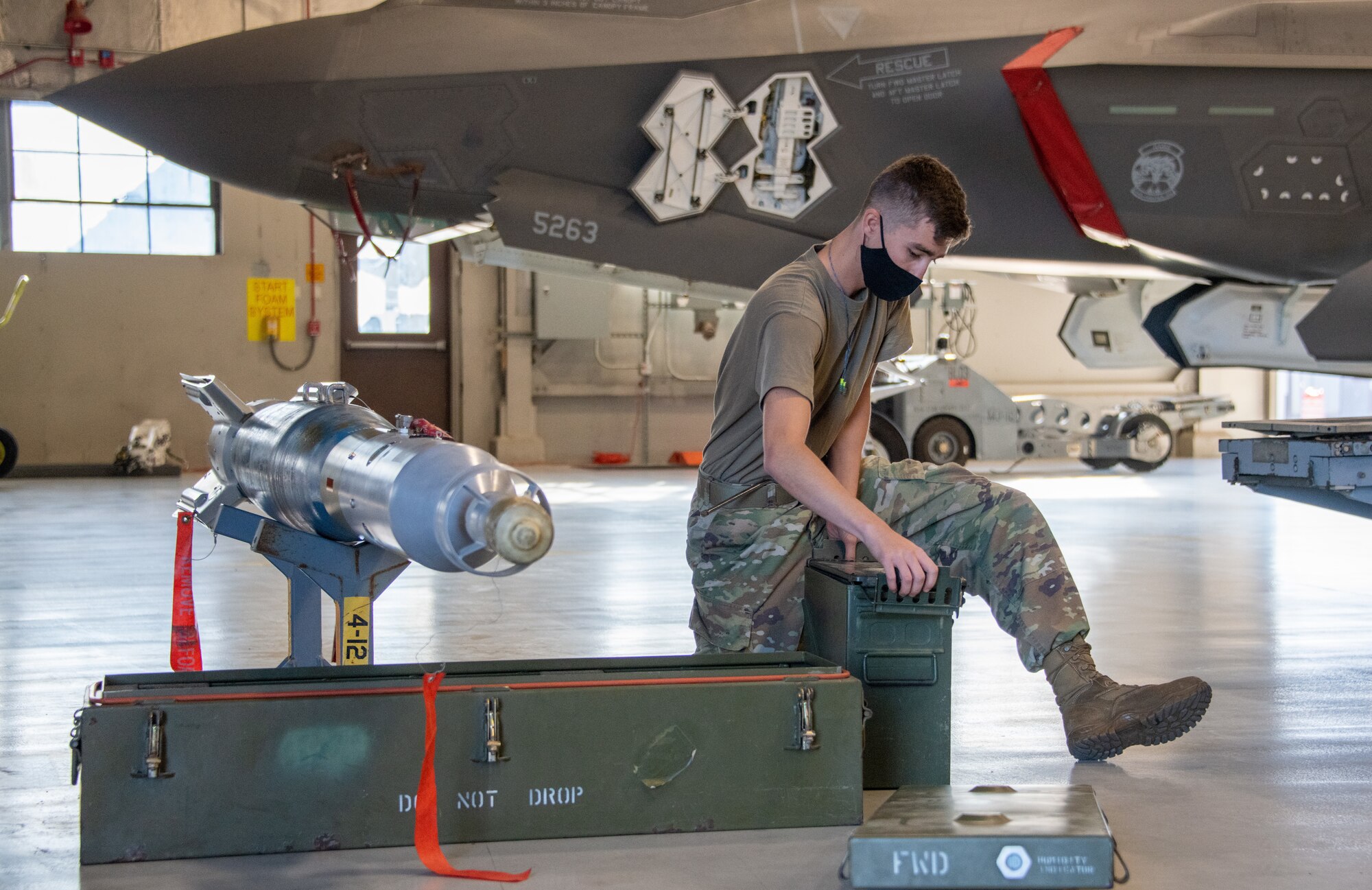 U.S. Air Force Staff Sgt. Connor Hansen from the 419th Aircraft Maintenance Squadron participates in a weapons load competition at Hill Air Force Base, Utah on Sept. 24, 2021. The quarterly competition focuses on speed, accuracy, and safety, ensuring standard loading procedures and proficiency across the wings. (U.S. Air Force photo by Senior Airman Erica Webster)