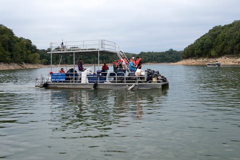 Members of the Pulaski County High School Future Farmers of America organization transport trash to the boat ramp at Burnside Island State Park the group picked up along the Lake Cumberland shoreline Sept. 25, 2021 on National Public Lands Day. The U.S. Army Corps of Engineers Nashville District’s staff at the lake worked with partners and volunteers to pick up tons of trash around the lake. (USACE Photo by Lee Roberts)