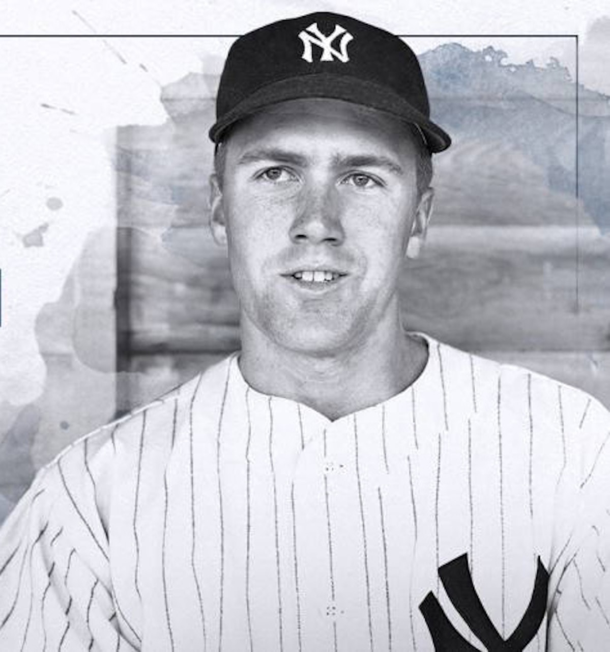 A baseball player poses for a photo.