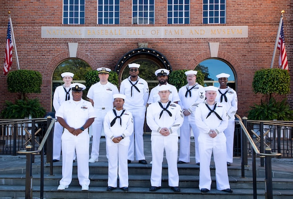 Lt. j.g. Logan Krause, Logistics Specialist Chief Petty Officer Mario Lacey, Quartermaster Chief Petty Officer Angel Herrera, Operations Specialist 1st Class Angela Diaz, Electronics Technician 1st Class Jaime Mobley, Information System Technician 1st Class Austin Vosburg, Electricians Mate 1st Class Allen Frey, Engineman 2nd Class Daija Jules, Logistics Specialist 3rd Class Noah Creer, and Culinary Specialist Seaman Austin Albright assigned to littoral combat ship PCU COOPERSTOWN (LCS 23) posing for a picture outside the National Baseball Hall of Fame. Taken before receiving a guided tour of the Hall of Fame, September 24. Crew members are visiting the ship's namesake city to participate in a tour of the National Baseball Hall of Fame and the city itself. (U.S. Navy photo by Milo Stewart Jr.)