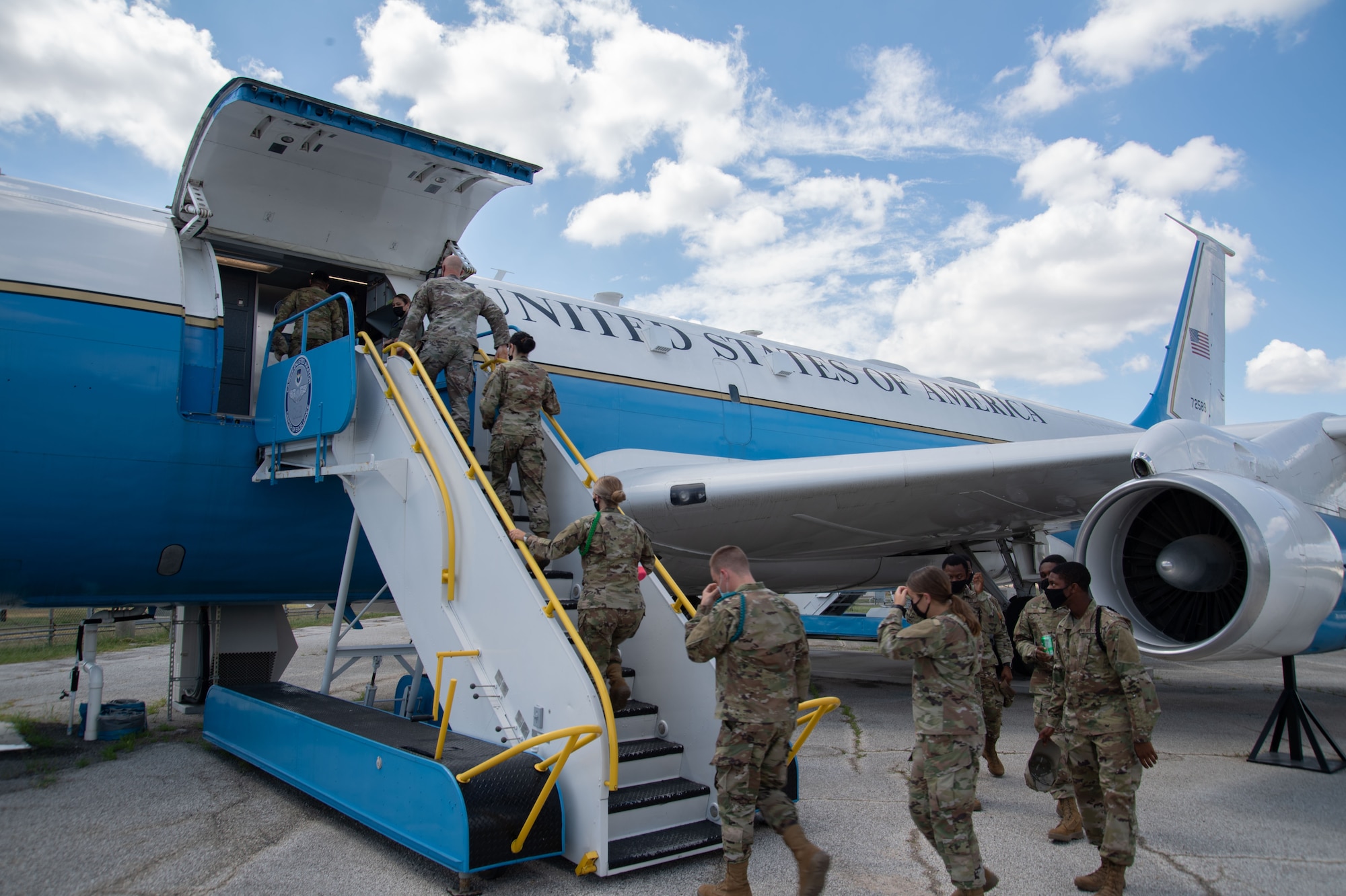 Students board aircraft