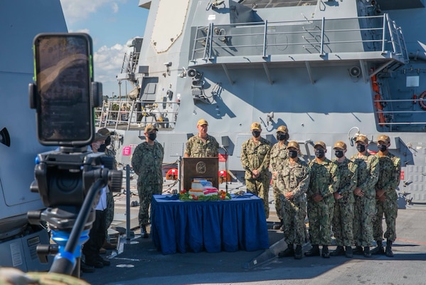 Rear Adm. Brendan McLane, commander, Naval Surface Force Atlantic, introduces the Task Group Greyhound (TGG) Initiative during a livestream aboard the guided-missile destroyer USS Thomas Hudner (DDG 116). TGG is a force generation initiative, inside the Optimized Fleet Response Plan (OFRP) construct, designed to provide the Fleet with predictable, continuously ready, and fully certified warships ready to accomplish the full range of fleet tasking. (U.S. Navy photo by Mass Communication Specialist 3rd Class Aaron Lau/Released)