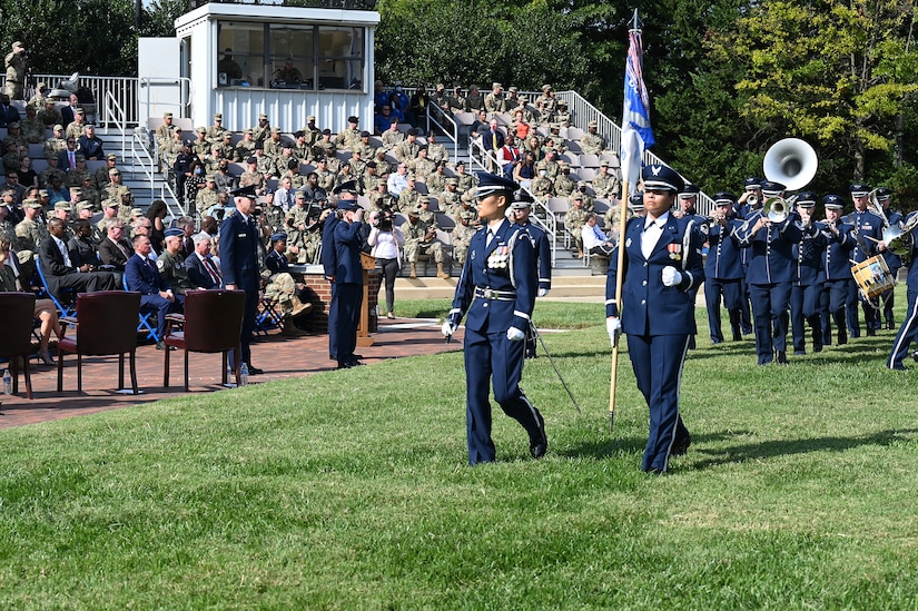 Members of The United States Air Force Band Ceremonial Brass conduct a pass in review in front of U.S. Air Force Col. Cat Logan, incoming commander of Joint Base Anacostia-Bolling and the 11th Wing; outgoing JBAB and 11th Wing Commander Col. Mike Zuhlsdorf; and Air Force District of Washington and 320th Air Expeditionary Wing Commander Maj. Gen. Joel D. Jackson during a change of command ceremony at JBAB, Washington, D.C., Sept. 28, 2021. Logan took command from Zuhlsdorf, making her the first female commander of JBAB and the 11th Wing and the second commander of wing at JBAB since the Air Force wing took authority of the installation during the Department of Defense’s first-ever joint base service lead transfer in 2020. (U.S. Air Force photo by Staff Sgt. Kayla White)