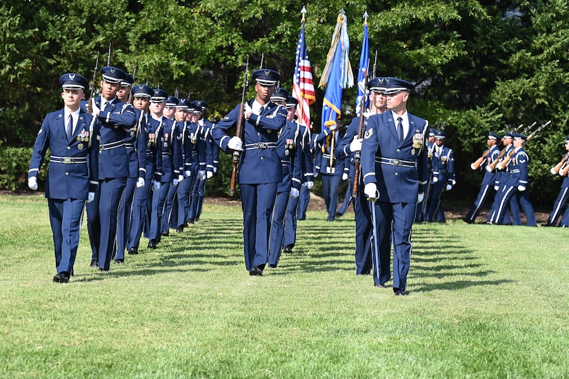 Members of The United States Air Force Honor Guard conduct a pass in review in front of U.S. Air Force Col. Cat Logan, incoming commander of Joint Base Anacostia-Bolling and the 11th Wing; outgoing JBAB and 11th Wing Commander Col. Mike Zuhlsdorf; and Air Force District of Washington and 320th Air Expeditionary Wing Commander Maj. Gen. Joel D. Jackson during a change of command ceremony at JBAB, Washington, D.C., Sept. 28, 2021. Logan took command from Zuhlsdorf, making her the first female commander of JBAB and the 11th Wing and the second commander of wing at JBAB since the Air Force wing took authority of the installation during the Department of Defense’s first-ever joint base service lead transfer in 2020. (U.S. Air Force photo by Staff Sgt. Kayla White)