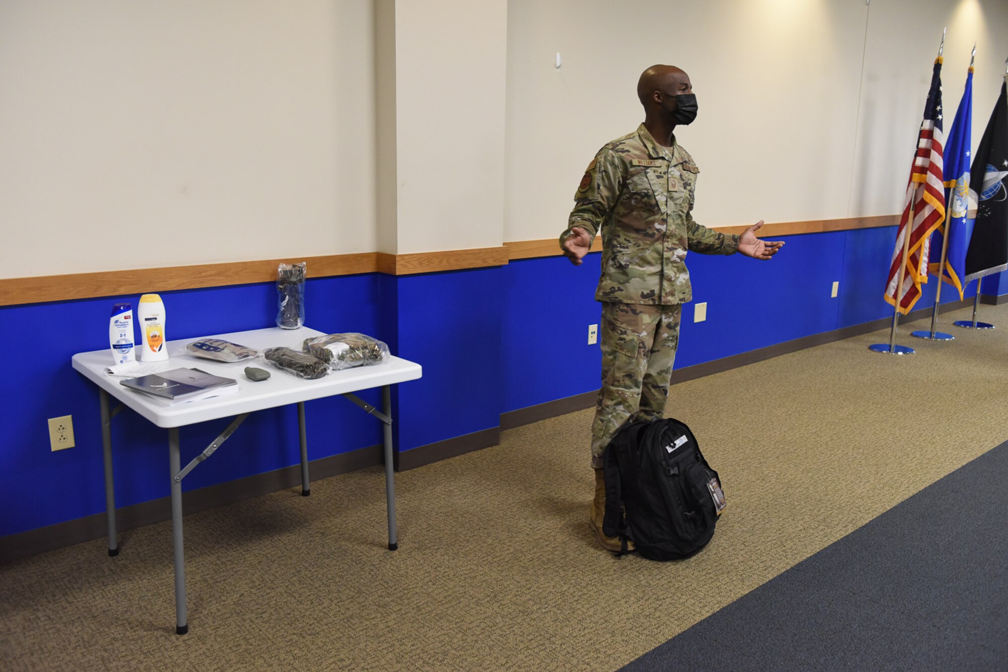 NCO displays backpack and items that basic trainees receive upon arrival.