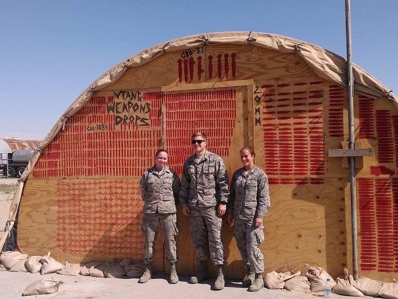 United States Air Force Airman 1st Class Caitlyn Durant (left), an aircraft armaments specialist, poses for a photo with other members of the 158th Fighter Wing, Vermont Air National Guard, during a deployment in February of 2016 to an undisclosed location in Southeast Asia. Now, Durant is a staff sergeant and has been with the 104th Fighter Wing, Massachusetts Air National Guard's Weapons Flight since January of 2021. (U.S. Air National Guard courtesy photo)