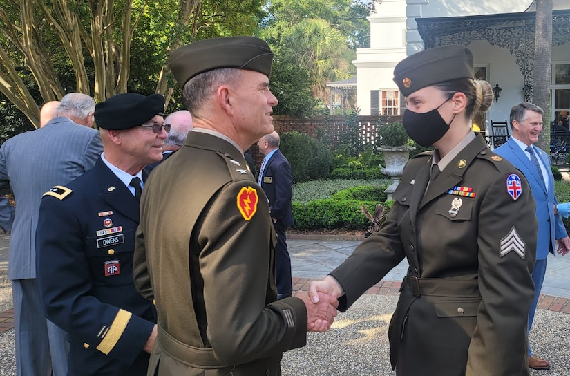 Maj. Gen. Joe Robinson, Commanding General, 3d Medical Command (Deployment Support) presents Sgt. Roxana Banaduc with a commanders coin of excellence for her nomination of her employer, Grand Strand Medical, for the ESGR Freedom Award on Sept. 28, 2021.