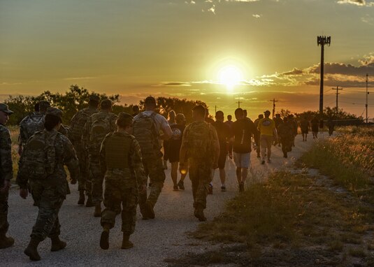 Goodfellow members ruck during the annual Jacobson Ruck March on Goodfellow Air Force Base, Texas, Sept. 28, 2021. Over 150 members showed their support in honoring Airman 1st Class Elizabeth Jacobson, a fallen defender from the 17th Security Forces Squadron. (U.S. Air Force photo by Senior Airman Ashley Thrash)