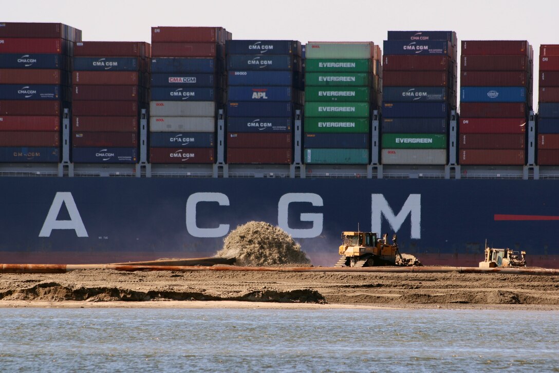 Dredged material from the Charleston harbor deepening project is added to Crab Bank, a 32-acre site of prime nesting habitat for many coastal birds, as a cargo ship passes in the background.  Prior to 2017, nearly 4,000 nests could be found in a single summer along with thousands of offspring. The island also provided rest and nourishment for hundreds of migrating shorebirds. But wind and waves have taken a toll on this unique resource and Crab Bank is now a tiny fraction of its original size. In 2017, Hurricane Irma washed away most of the remaining high ground, removing any opportunity for nesting birds.