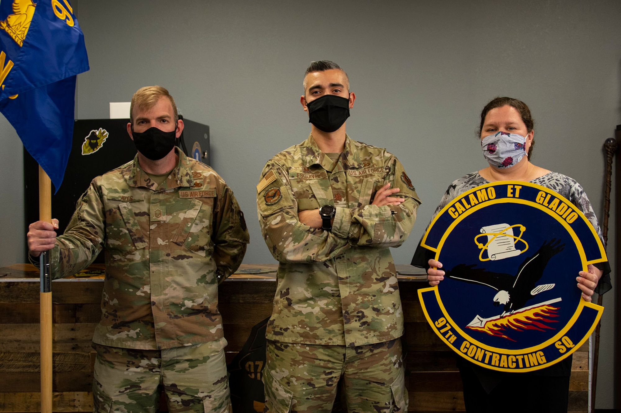 From left, U.S. Air Force Master Sgt. Christian Ates, 97th Contracting Squadron (CONS) senior enlisted leader, Maj. Jonathan Esquivel, 97th CONS commander, and Lori Clinton, 97th CONS director of business operations, gather for a photo at Altus Air Force Base, Oklahoma, Sept. 21, 2021. The 97th CONS was redesignated as a flight in June of 2014 due to manning, despite a steady increase in the amount of dollars and contracts the team managed after the base received the first KC-46 Pegasus. (U.S. Air Force photo by Senior Airman Amanda Lovelace)