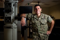 SANTA RITA, Guam (Feb. 17, 2021) Lt. Alfonso Sciacchitano, a native of Marietta, Georgia, assigned to Naval Submarine Training Center Pacific, Detachment Guam, poses for a portrait in the Submarine Multi-Mission Team Trainer at Konetzni Hall. Sciacchitano was announced as the 2020 Naval Education and Training Command Officer Instructor of the Year. (U.S. Navy photo by Mass Communication Specialist 2nd Class Kelsey J. Hockenberger)