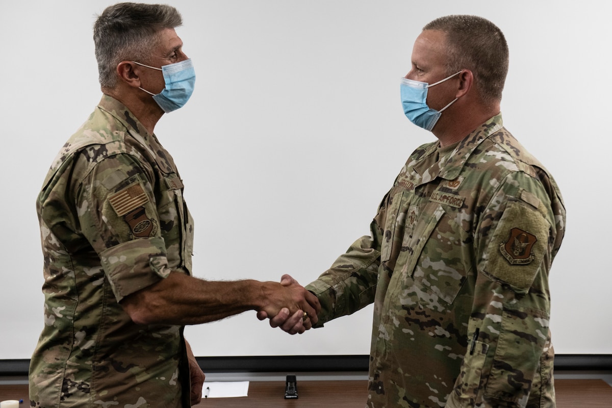 SMSgt. Jason Griffith, 932nd Civil Engineering Squadron, operations superintendent, receives the Lance P. Sijan U.S. Air Force Leadership Award presented by Col. Glenn Collins, 932nd Airlift Wing commander, August 8, 2021, Scott Air Force Base, Illinois. Lance P. Sijan U.S. Air Force Leadership Award recognizes the accomplishments of Airmen, both officers and enlisted, who demonstrate the highest qualities of leadership in the performance of their duties and conduct of their lives. (U.S. Air Force video by Staff Sgt. Brooke Spenner)