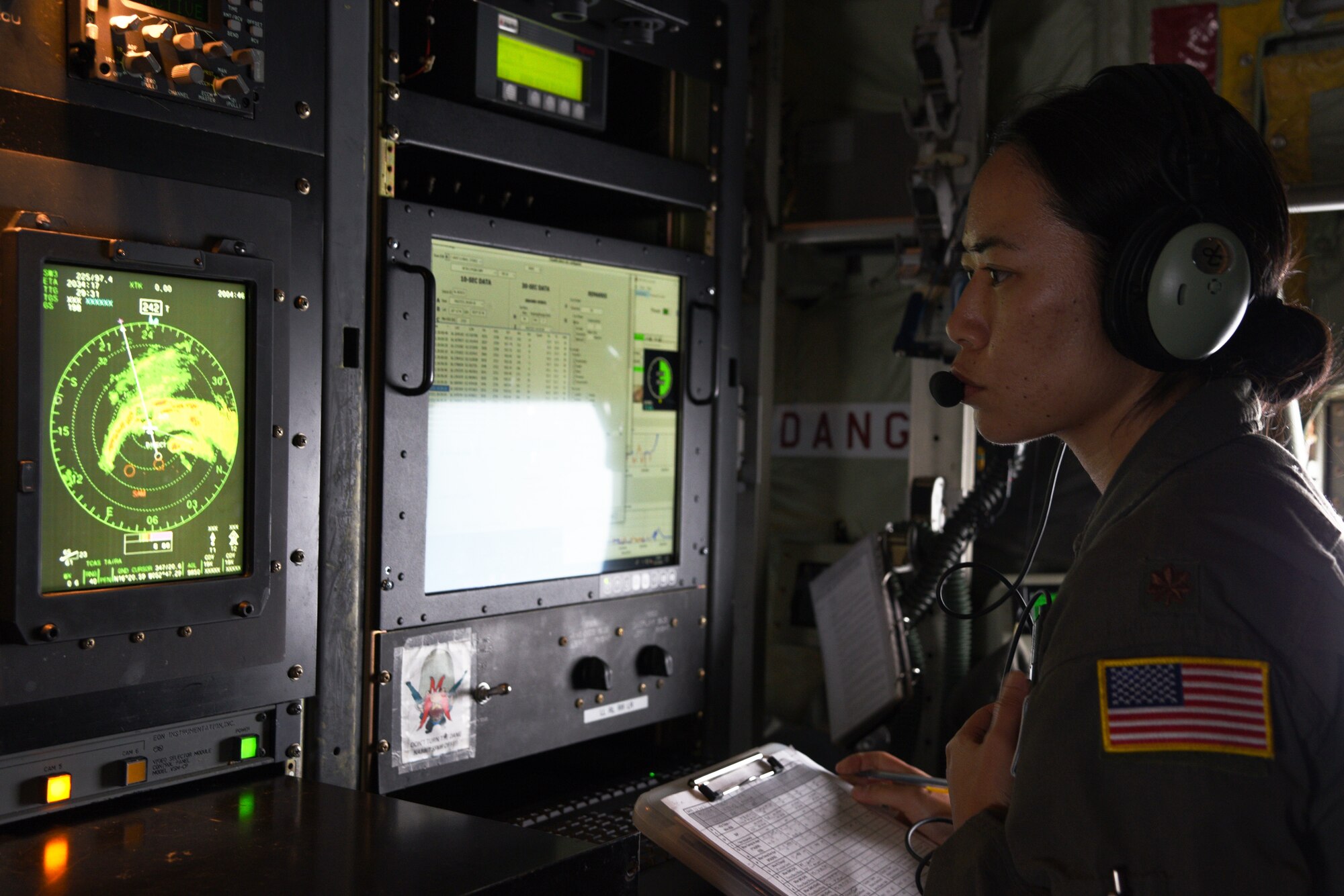 Maj. Joyce Hirai, 53rd Weather Reconnaissance Squadron aerial reconnaissance weather officer, checks the data from the dropsonde prior to sending it to the National Hurricane Center as the Hurricane Hunters, fly into Hurricane Sam, Sept. 27.  Hurricane Sam had downgraded to a category 3 hurricane when the AF Reserve Hurricane Hunters entered, but was intensifying before they headed back. The Hurricane Hunters gather data weather data from dropsondes and aircraft sensors, which is given to the NHC to assist them with their forecasts and storm warnings. (U.S. Air Force photo by Jessica L. Kendziorek)