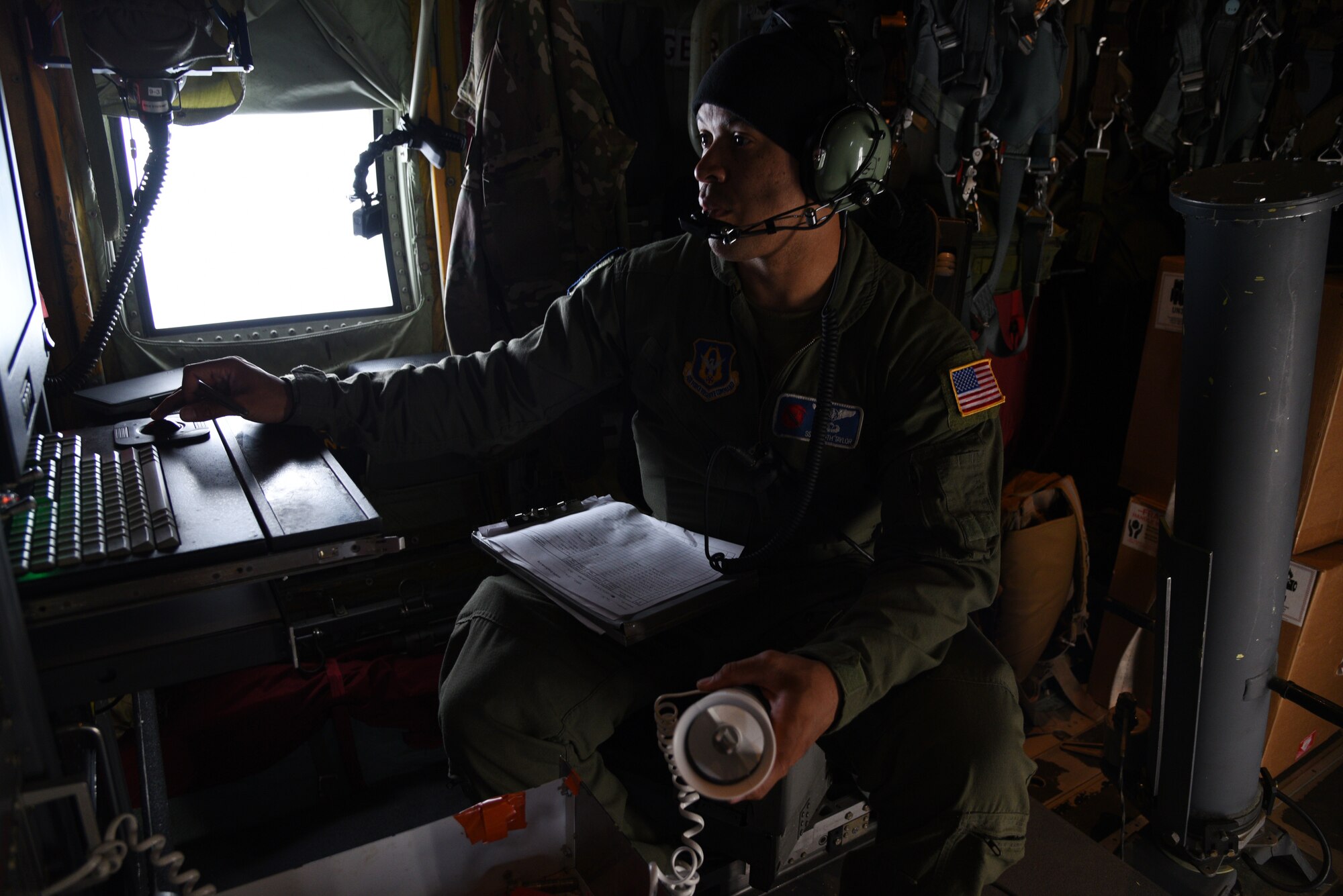 Staff Sgt. Keith Taylor, 53rd Weather Reconnaissance Squadron loadmaster, prepares dropsondes for the storm as the Hurricane Hunters fly into Hurricane Sam, Sept. 27, 2021.  Hurricane Sam had downgraded to a category 3 hurricane when the AF Reserve Hurricane Hunters entered, but was intensifying before they headed back. The Hurricane Hunters gather data weather data from dropsondes and aircraft sensors, which is given to the National Hurricane Center to assist them with their forecasts and storm warnings. (U.S. Air Force photo by Jessica L. Kendziorek)