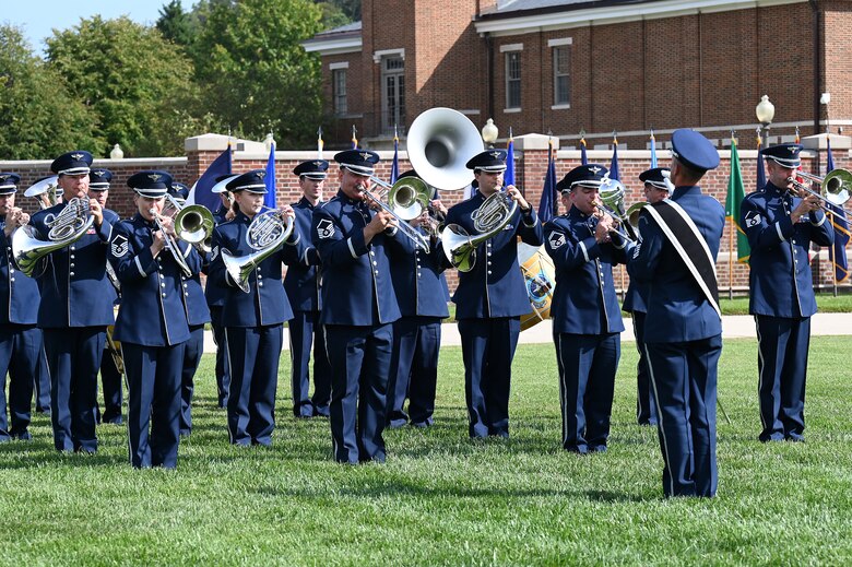 Members of The United States Air Force Band Ceremonial Brass perform during a change of command ceremony at Joint Base Anacostia-Bolling, Washington, D.C., Sept. 28, 2021. U.S. Air Force Col. Cat Logan took command of JBAB and the 11th Wing from outgoing commander Col. Mike Zuhlsdorf. In doing so, Logan became the first female commander of JBAB and the 11th Wing and the second commander of wing at JBAB since the Air Force wing took authority of the installation during the Department of Defense’s first-ever joint base service lead transfer in 2020. (U.S. Air Force photo by Staff Sgt. Kayla White)